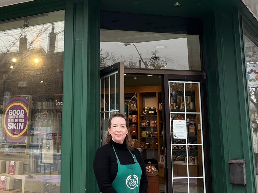 Body Shop Store Manager Michelle McCracken standing underneath the Body Shop sign at the Bloor West Village branch located on 2366 Bloor St W.Photo Credits: Victoria Hincapie Gomez